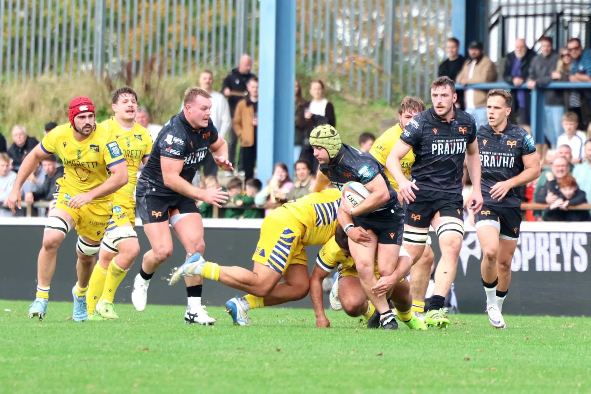 Harri Daves carries forward for the Ospreys with Dewi Lake in support. Pic: Owen Morgan