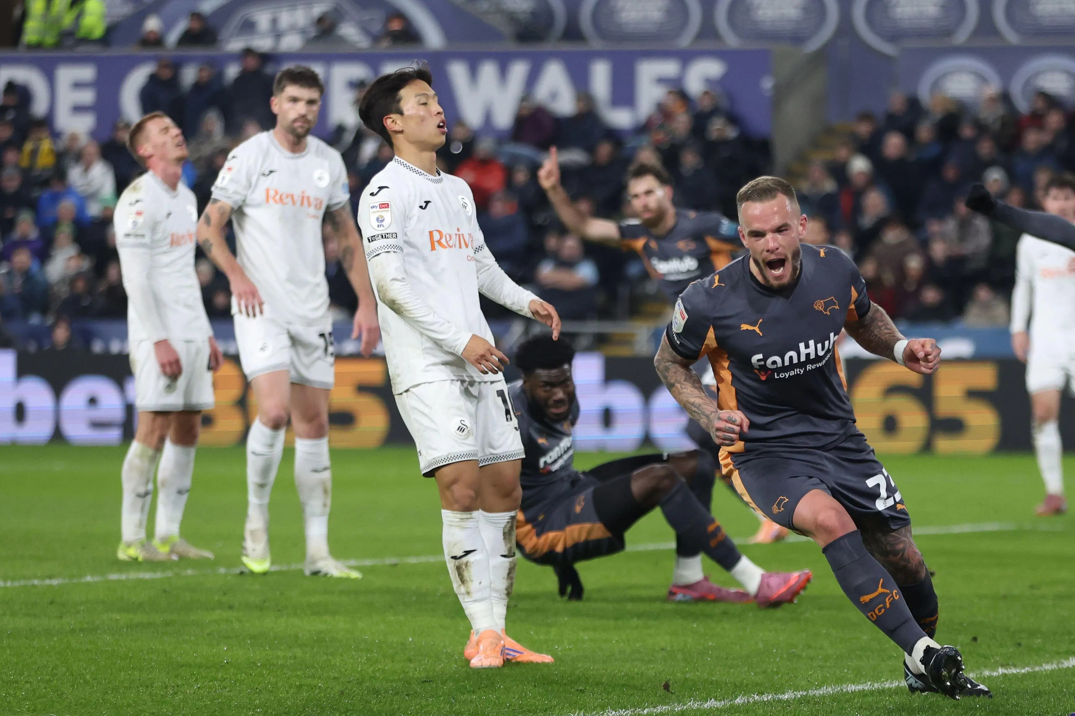 Derby County's Joe Ward (right) celebrates scoring his side's first goal. Pic: Alamy