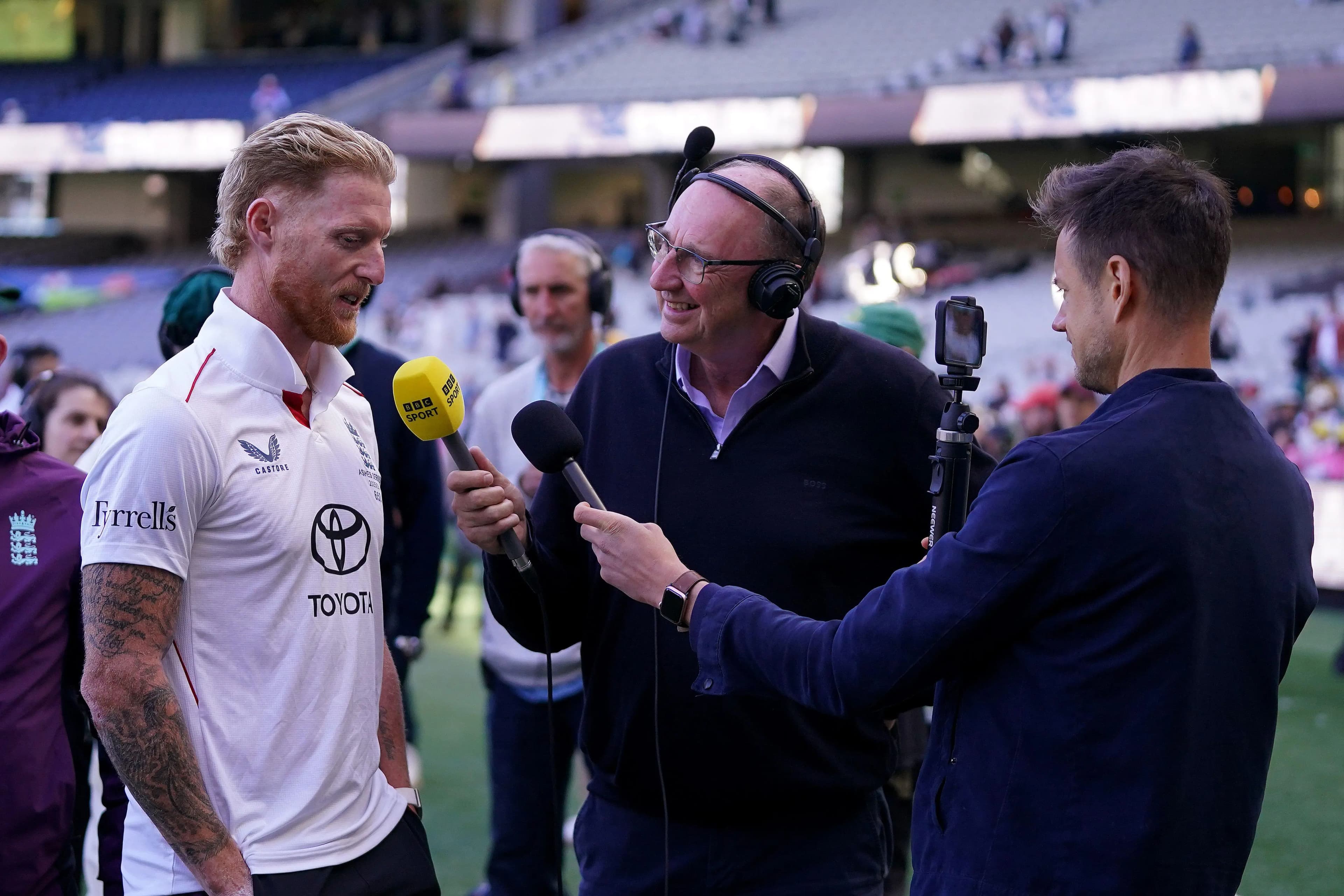 England’s Ben Stokes (left) is interviewed by BBC Sport's Jonathan Agnew (centre) and Henry Moeran (right). Pic: Alamy