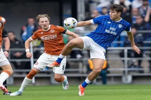 Rubin Colwill of Cardiff City beats Charlie Savage of Reading to the ball. Pic: Alamy