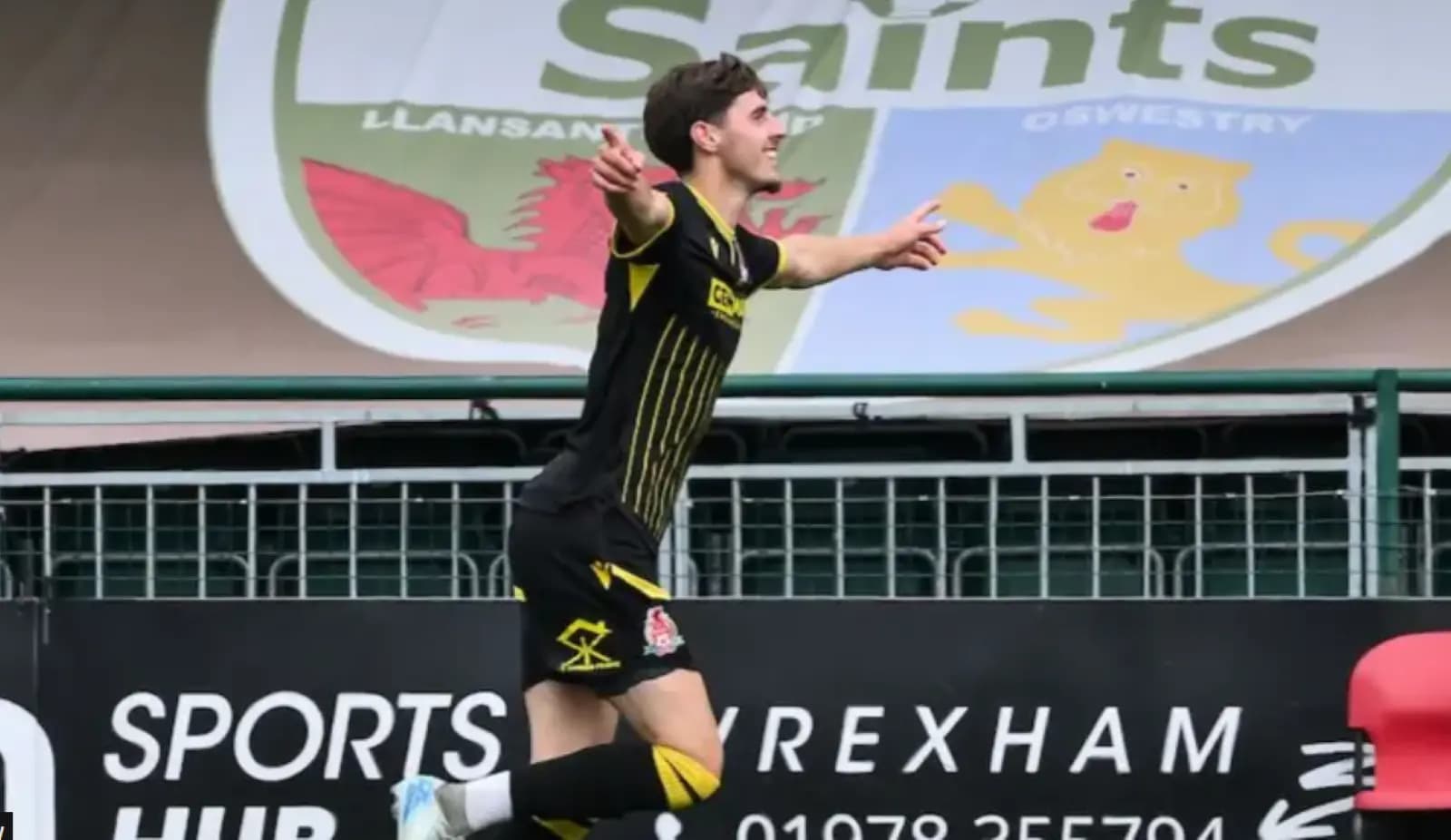 Briton Ferry Llansawel's Reuben Davies celebrates. Pic: FAW