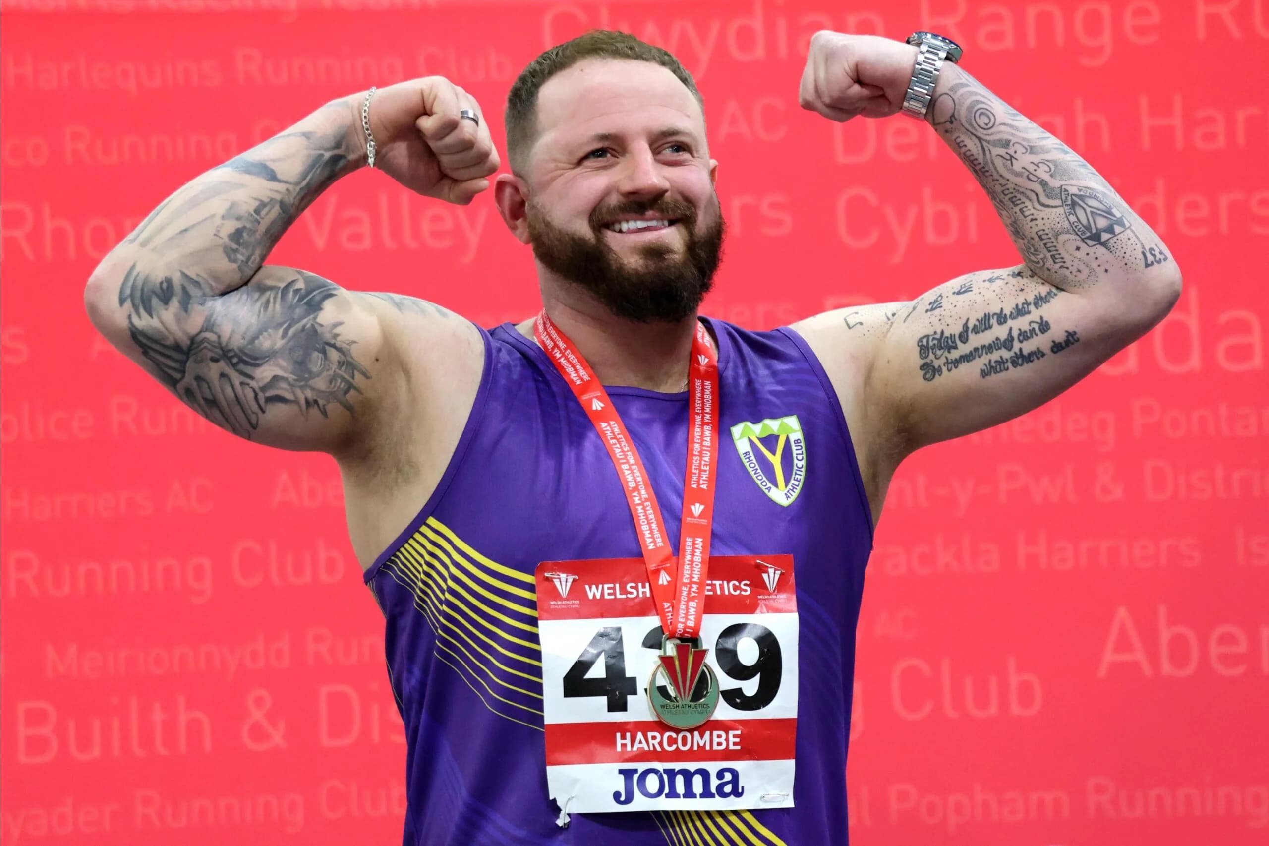Adam Harcombe celebrates his gold medal at the Welsh Indoor Athletics Championships. Pic: Owen Morgan