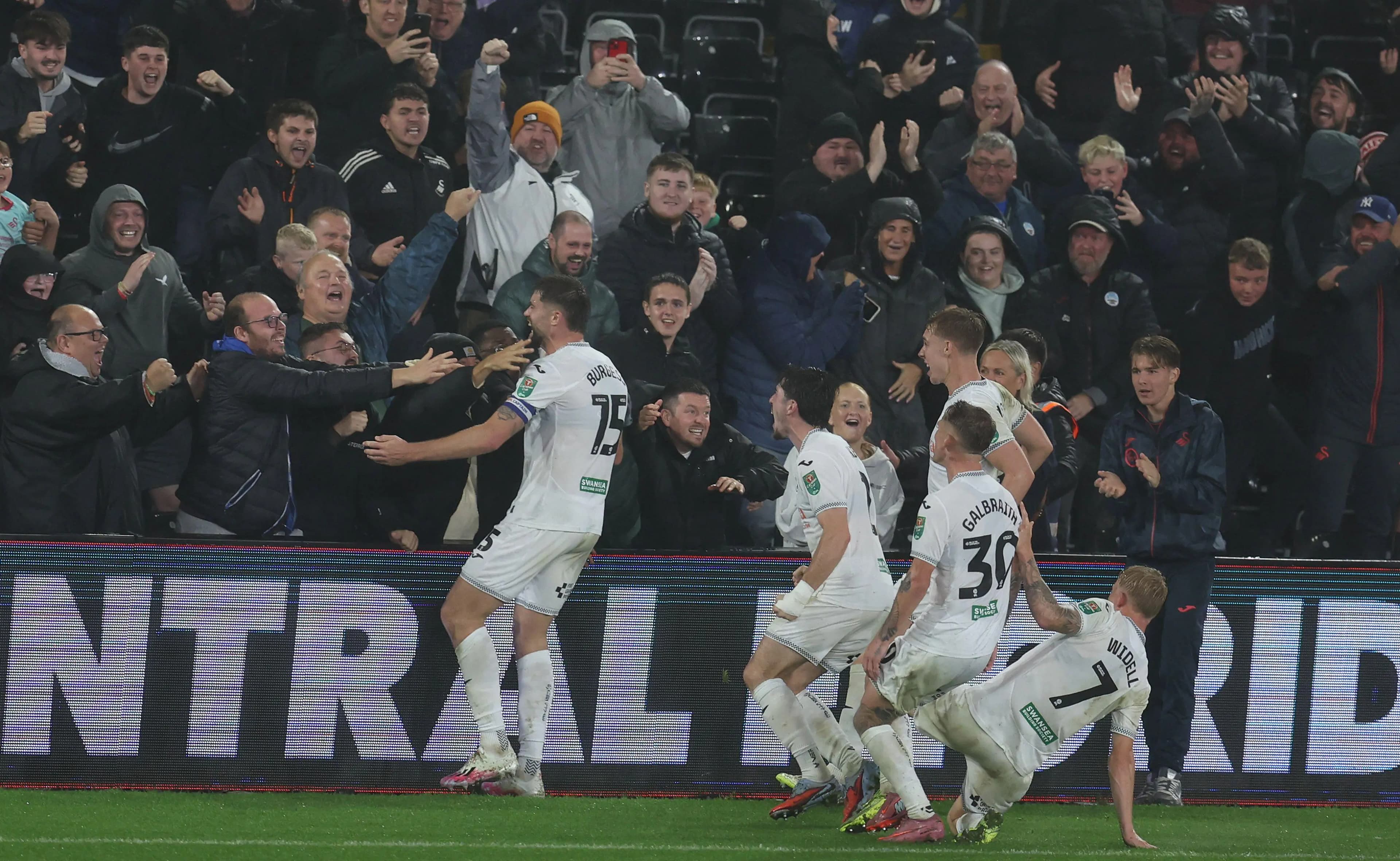 Cameron Burgess celebrates his dramatic winner for Swansea City. Pic: Alamy