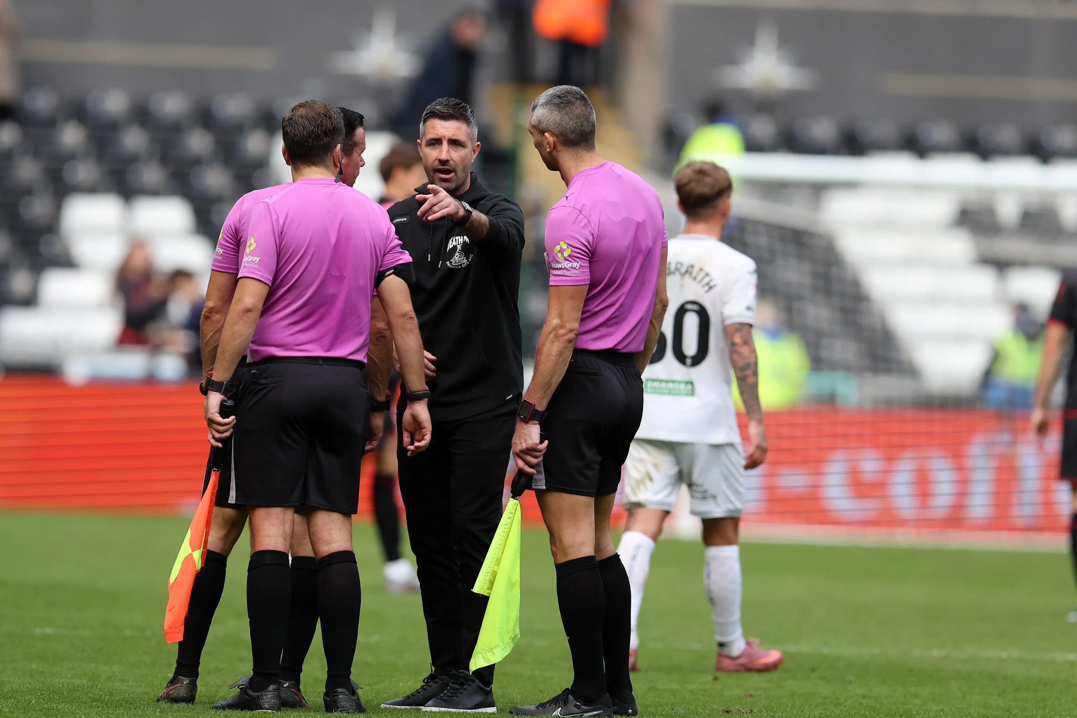 Swansea City head coach Alan Sheehan confronts referee Dean Whitestone. Pic: Alamy