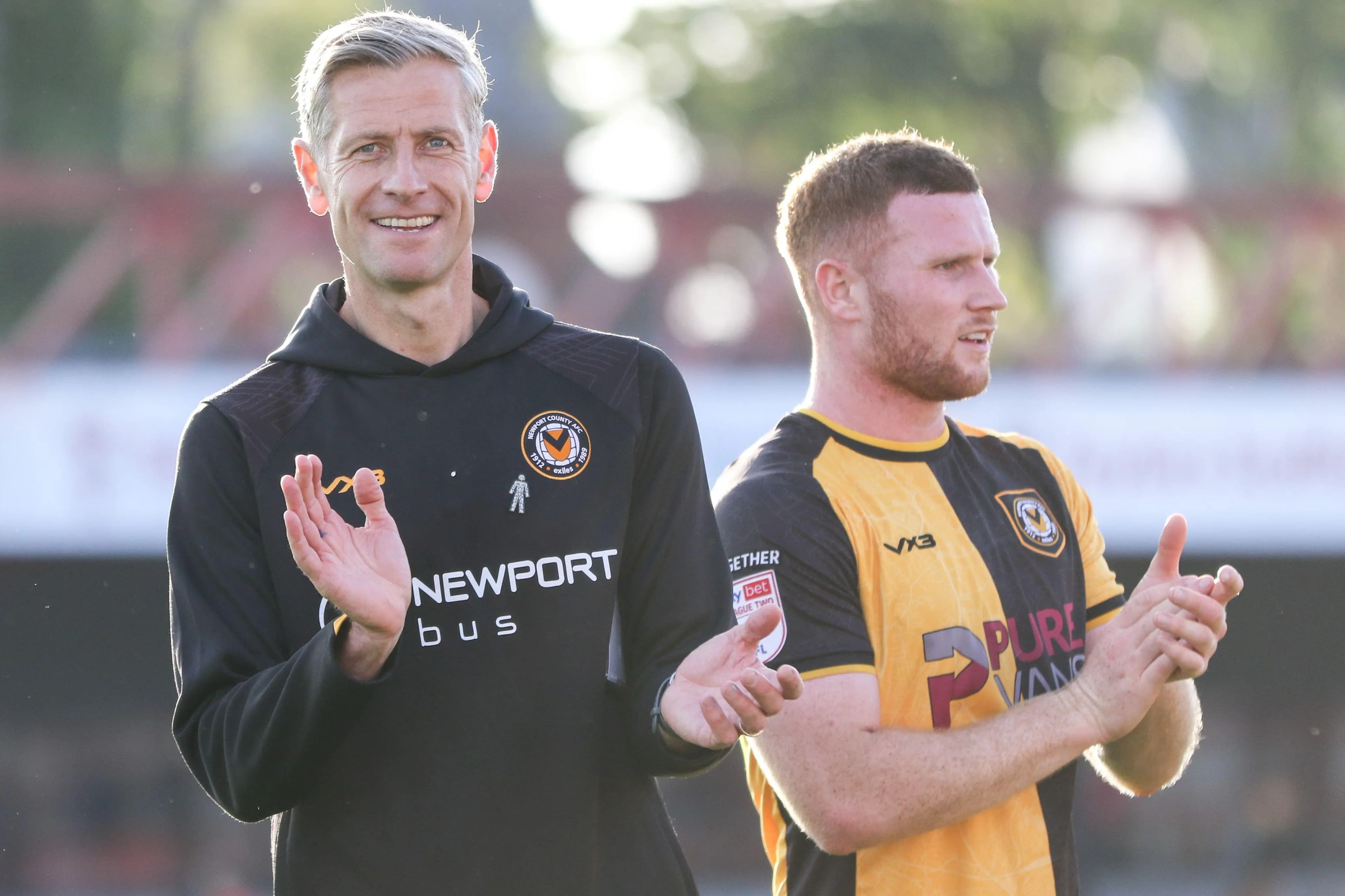Newport County manager David Hughes (left) and defender Lee Jenkins. Pic: Alamy