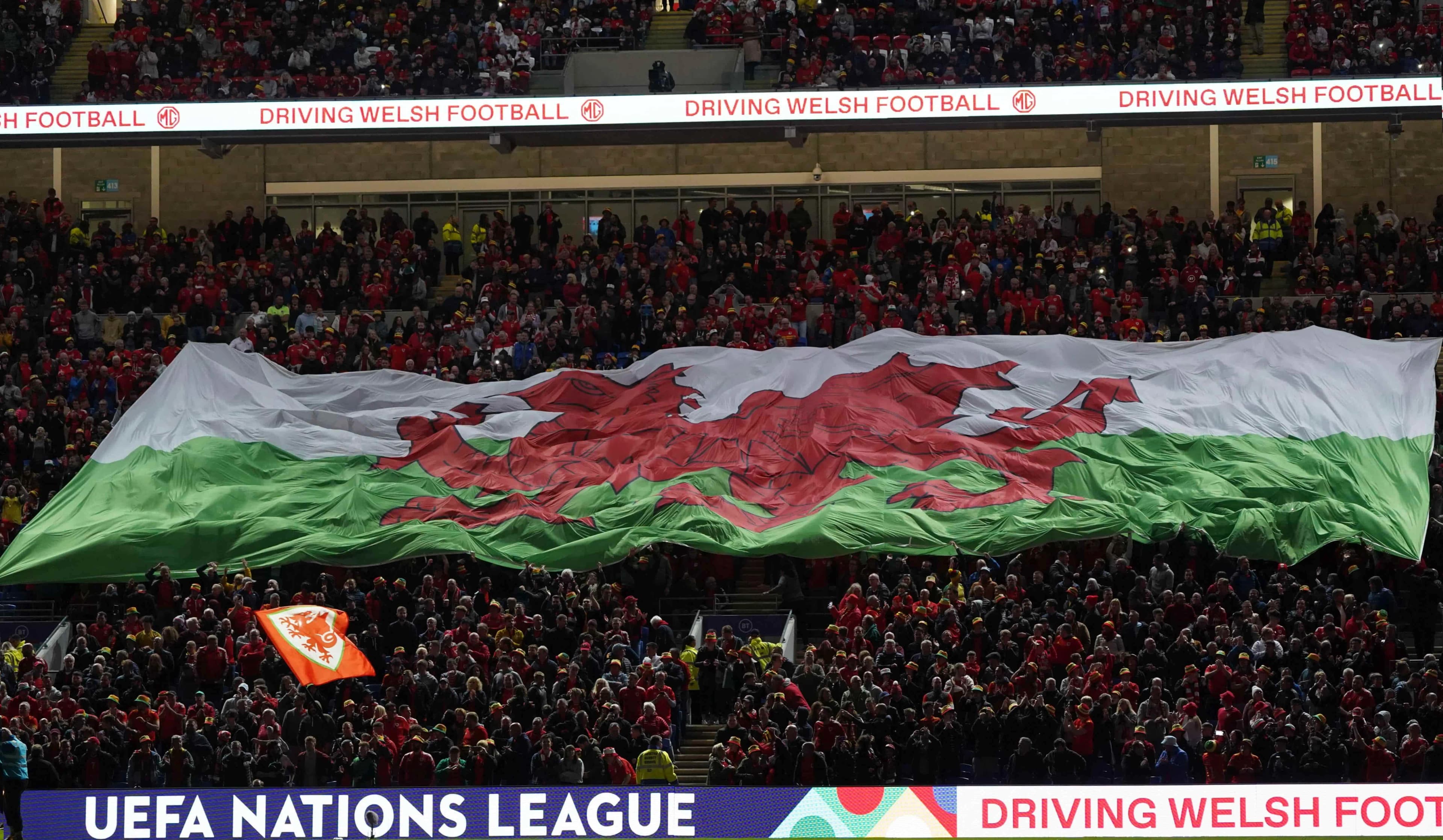 Cardiff Millenium Stadium Giant Welsh Flag Red Dragon is unfurled Credit: David Williams / Alamy