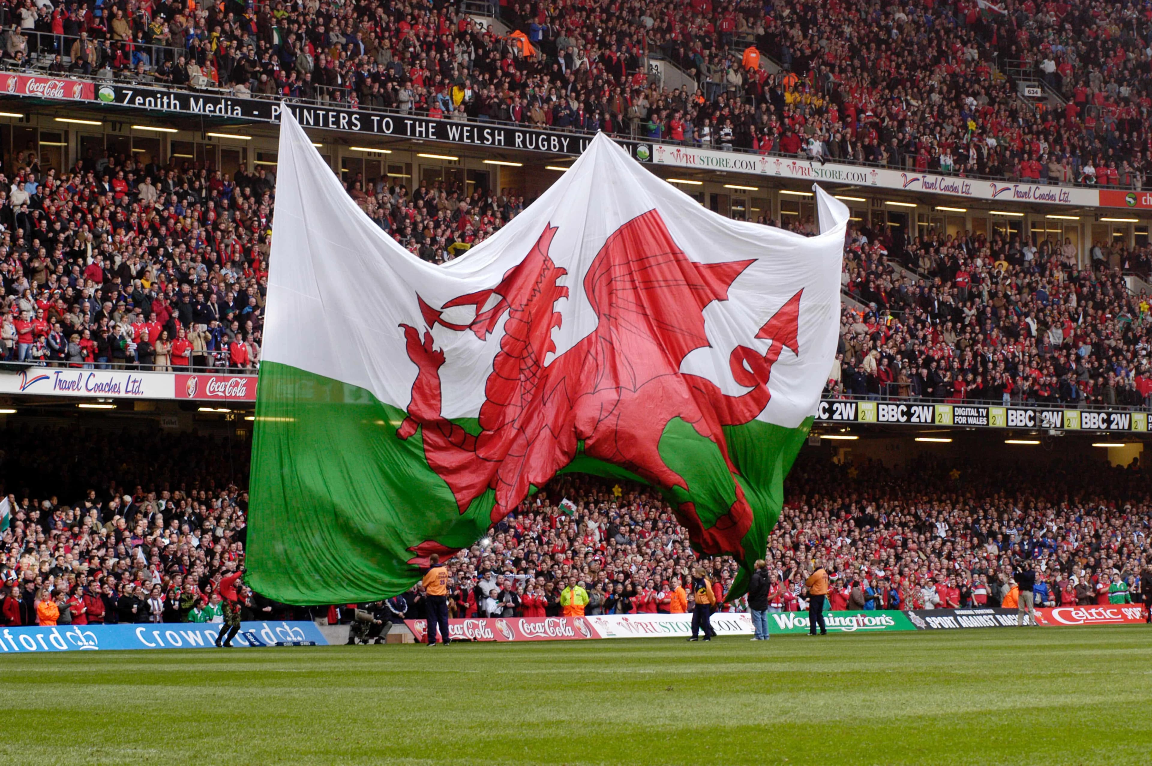 Cardiff Millenium Stadium Giant Welsh Flag is unfurled Credit: David Williams / Alamy