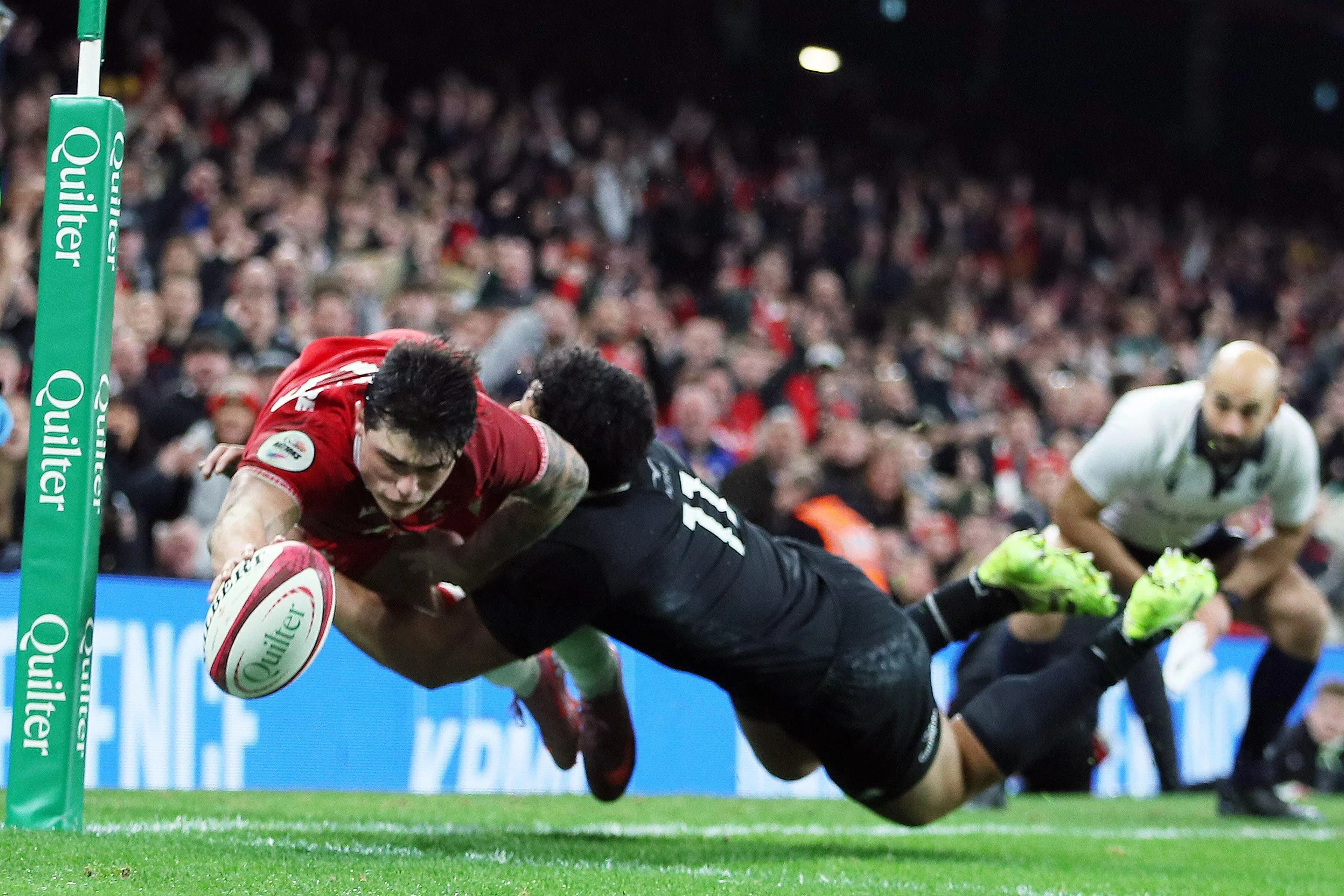 Louis Rees-Zammit scores for Wales. Pic: Alamy