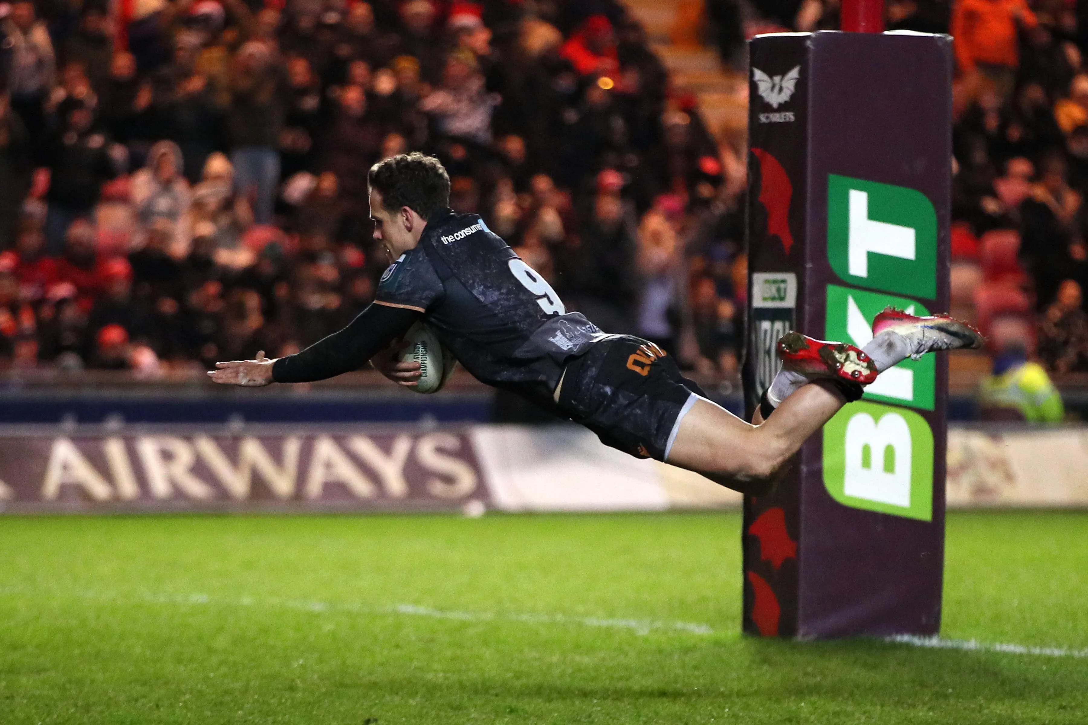 Kieran Hardy scores for the Ospreys against the Scarlets. Pic: Alamy