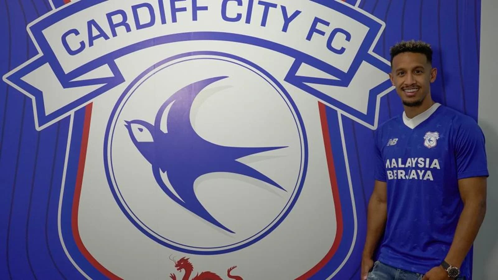 Callum Robinson by the Cardiff City crest
