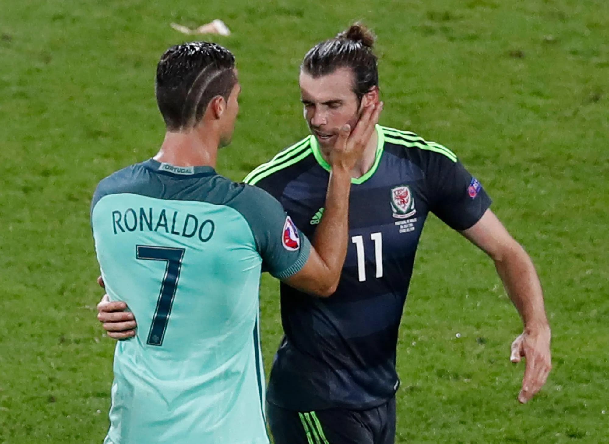Portugal's Cristiano Ronaldo comforts Wales' Gareth Bale after Portugal won 2-0 during the Euro 2016. Pic. Alamy