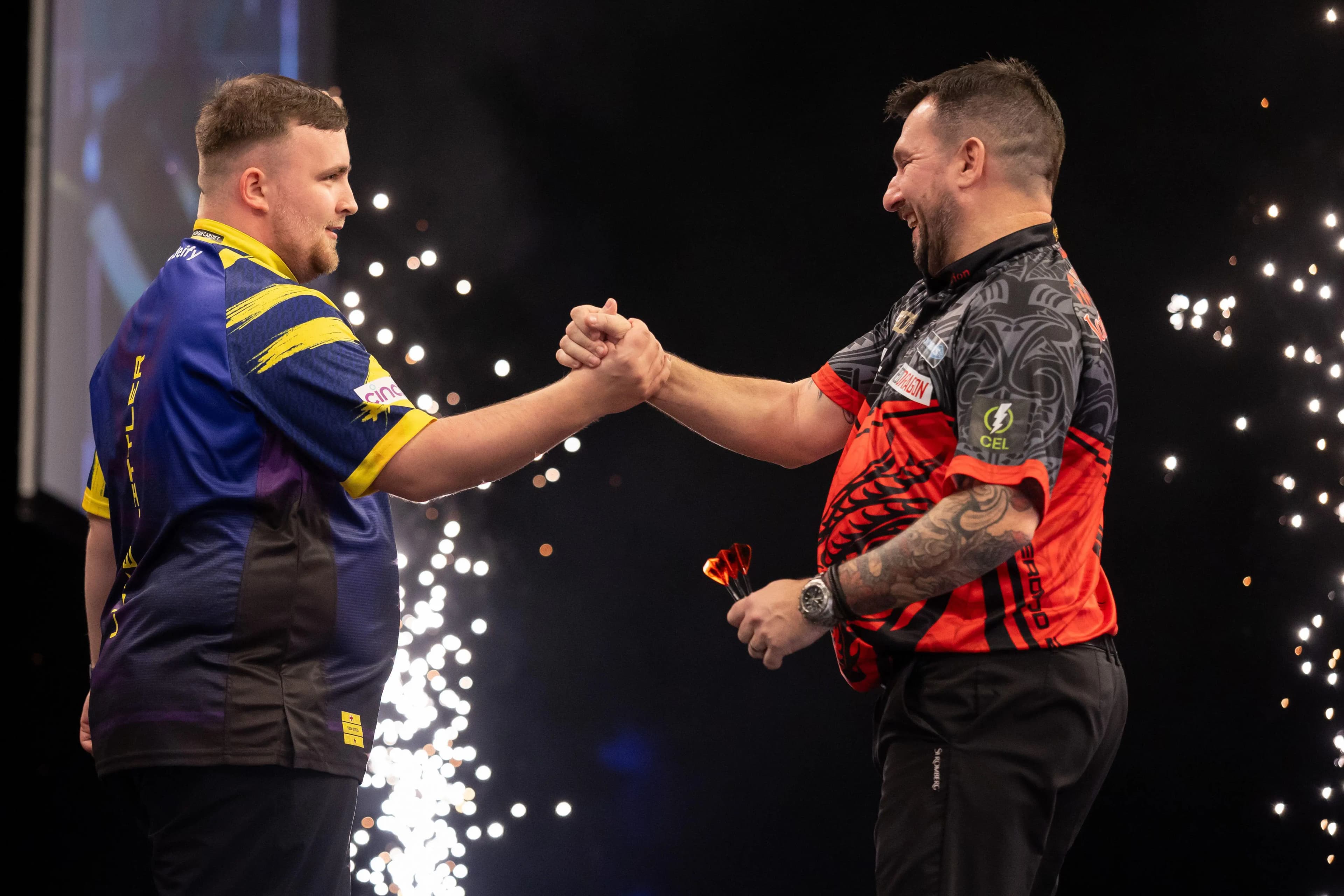 Luke Littler (L) shakes the hand of Johnny Clayton (R). Pic. Alamy
