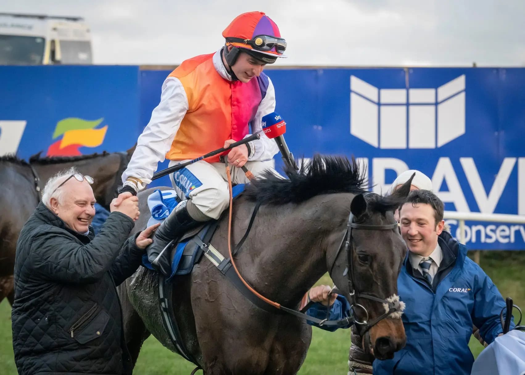 Sean Bowen is congratulated by father Peter Bowen after winning the Coral Welsh Grand National on Haiti Couleurs at Chepstow. Pic: Alamy.