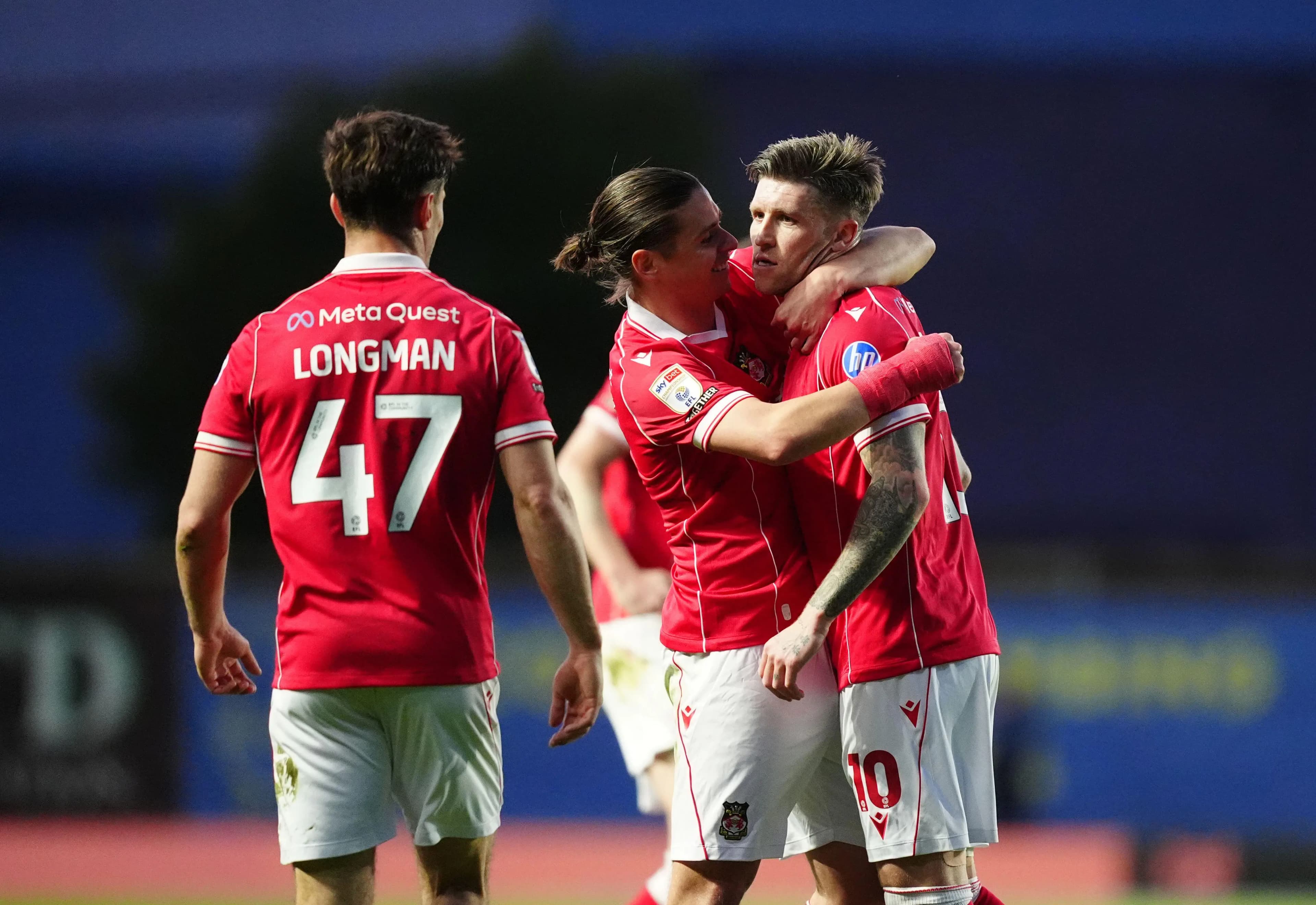 Josh Windass is congratulated after scoring for Wrexham. Pic: Alamy