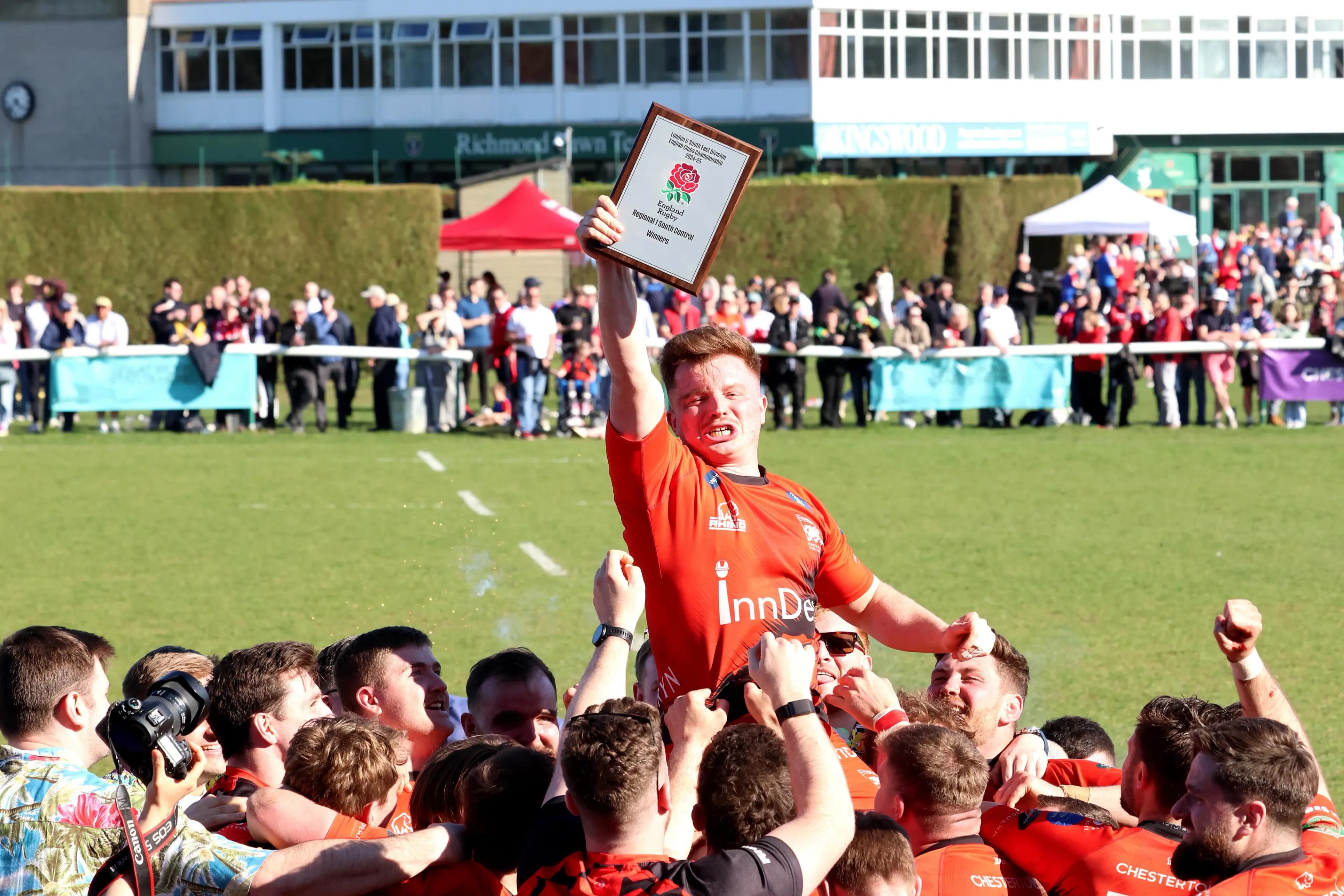 London Welsh players hold the Regional 1 South Central championship winners plaque aloft at Old Deer Park. Pic: Owen Morgan