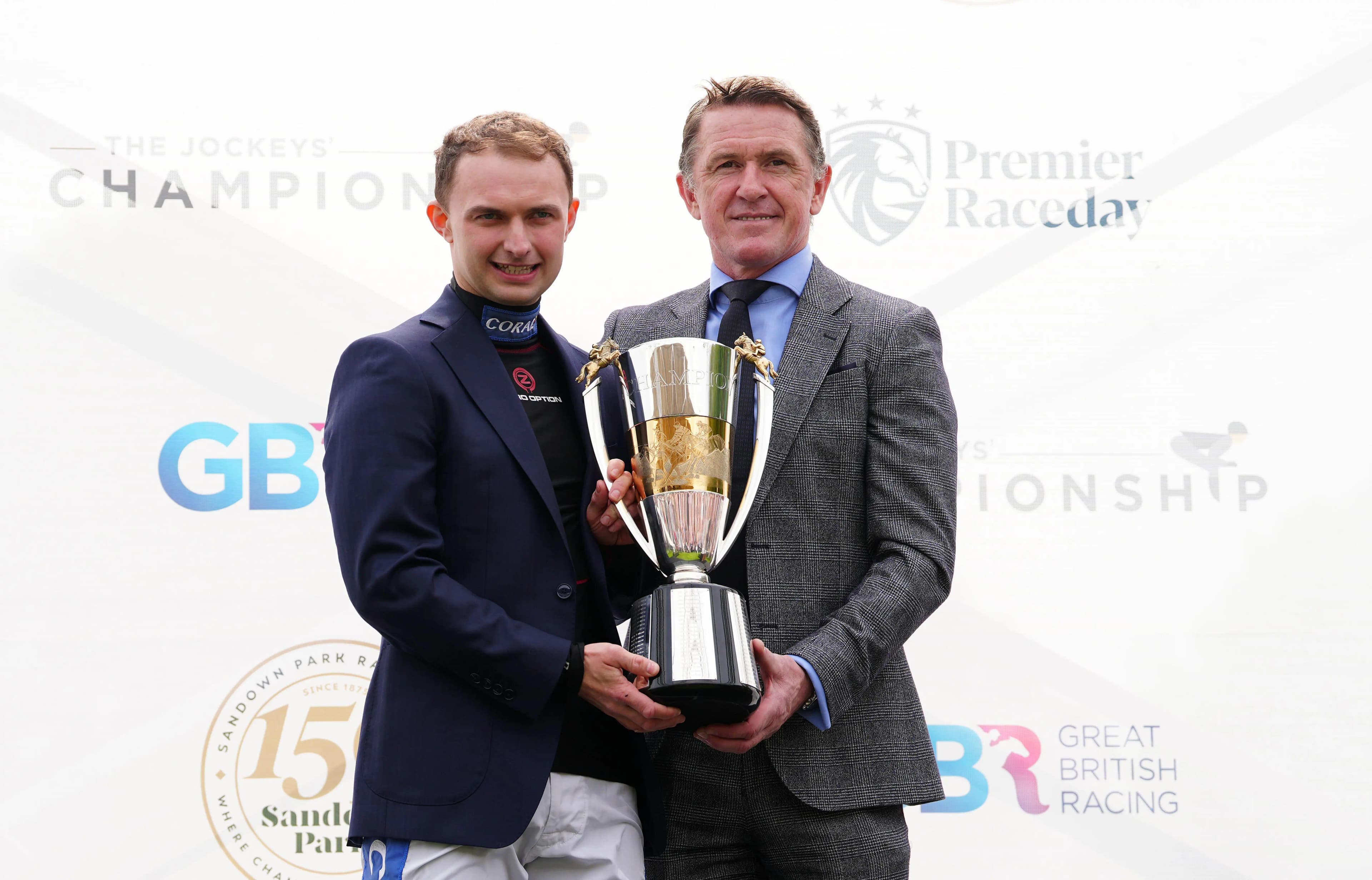 Sean Bowen receives the champion jockey trophy from AP McCoy