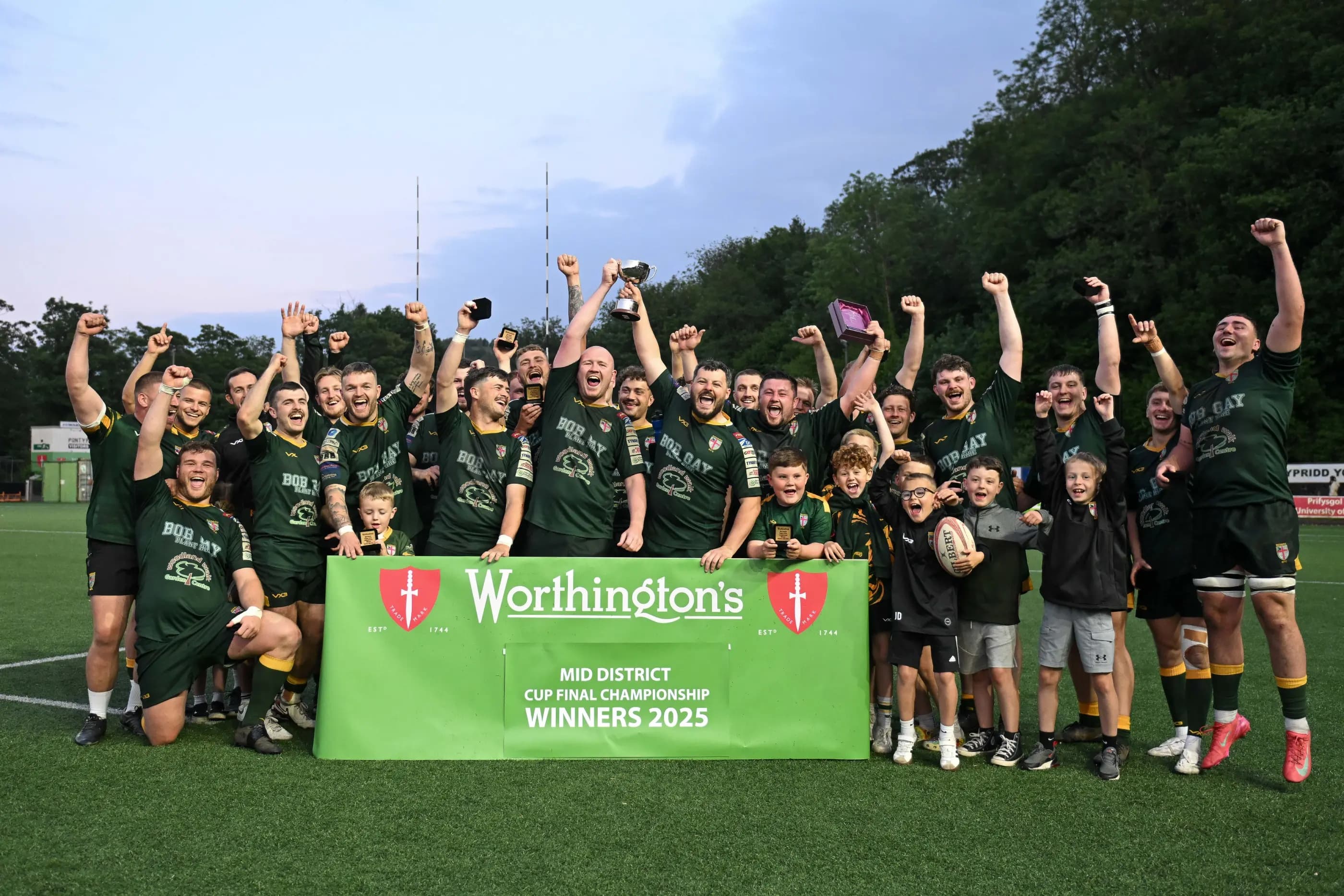 Beddau lift the Worthington’s Mid District Championship Cup. Pic: Mike Jones/Replay Images.