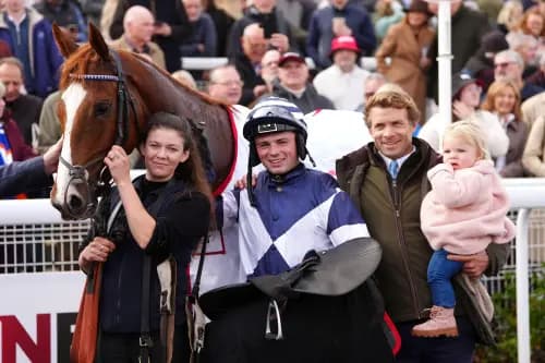 Dylan Johnston (centre), trainer Sam Thomas (right) and connections after winning the the DragonBet 'Welsh Champion' Hurdle with Celtic Dino. Pic: Alamy
