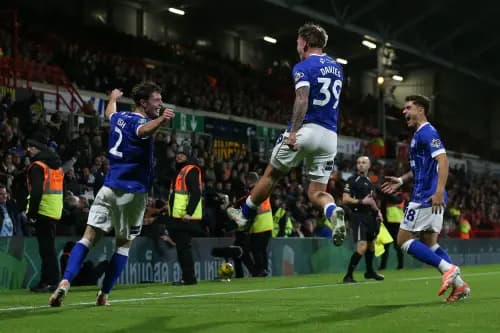 Will Fish of Cardiff City (left) celebrates with his teammates after scoring. Pic: Alamy.