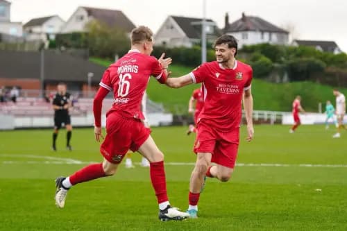 Jac Norris celebrates his goal for Llanelli. Pic: Llanelli Town.