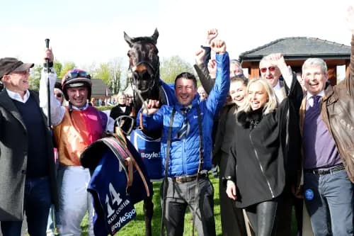 Jockey Sean Bowen and trainer Rebecca Curtis (second right) celebrate with the winning connections after their horse Haiti Couleurs won the Irish Grand National . Pic: Alamy