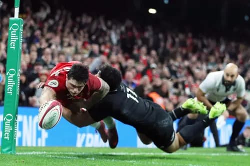 Louis Rees-Zammit scores for Wales. Pic: Alamy