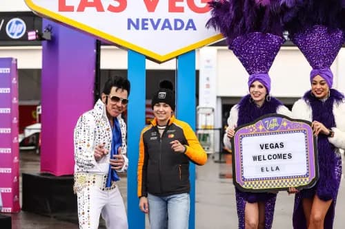 Ella Lloyd, poses with an Elvis impersonator during the F1 Academy Welcome to Las Vegas event.