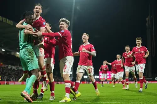 Wrexham goalkeeper Arthur Okonkwo celebrates with teammates. Pic: Alamy.