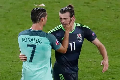 Portugal's Cristiano Ronaldo comforts Wales' Gareth Bale after Portugal won 2-0 during the Euro 2016. Pic. Alamy