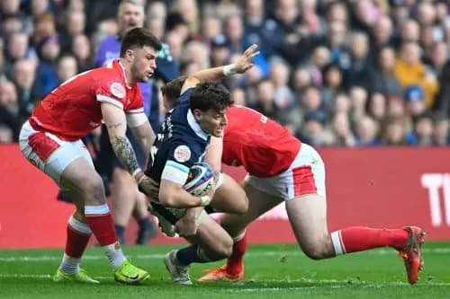 Tom Rogers of Wales, Tom Jordan of Scotland and Blair Murray of Wales during the 2025 Six Nations Championship. Pic. Alamy