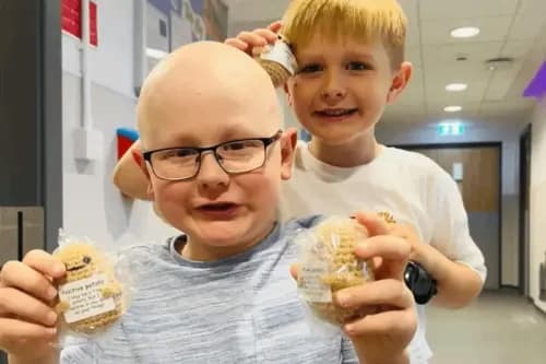 Frazer Tait and his “positive potatoes”, with brother Nathan.