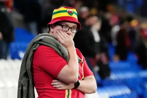 A Wales fan considers the impact of another penalty shoot-out defeat. Pic: Alamy