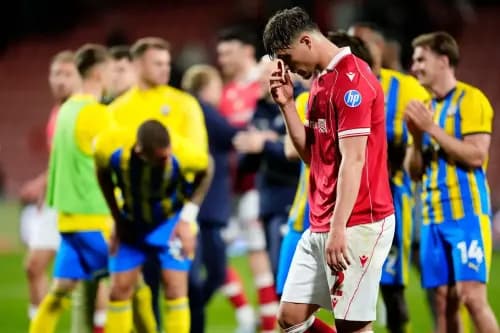 Wrexham's Callum Doyle shows his dejection after defeat to Southampton. Pic: Alamy