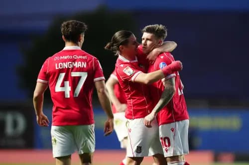 Josh Windass is congratulated after scoring for Wrexham. Pic: Alamy